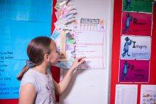 A student examines a visual schedule