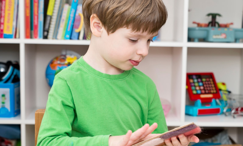 A young child reading a book