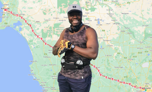 George standing in front of a map outlining his run.