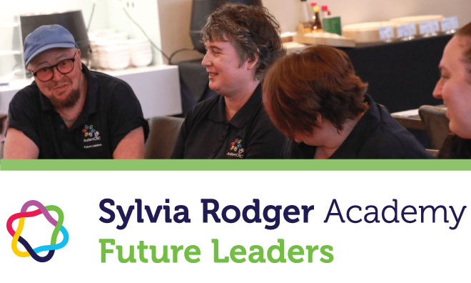 Image of people taking around a table and smiling with text: Sylvia Rodger Academy Future Leaders