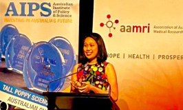 Chloe Yap standing at a podium