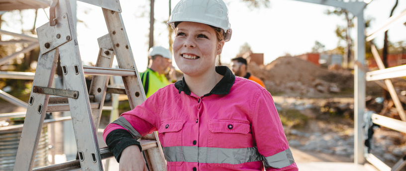 An employee smiling at a job site