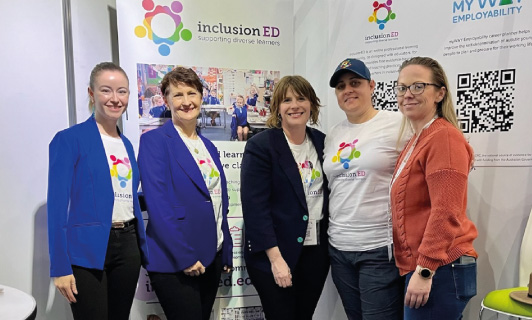 A group of people in front of banners for inclusionED and myWAY Employability