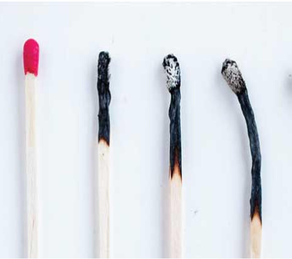 An image of four matches. The first match is unburnt, and each of the following matches are increasingly burnt out.